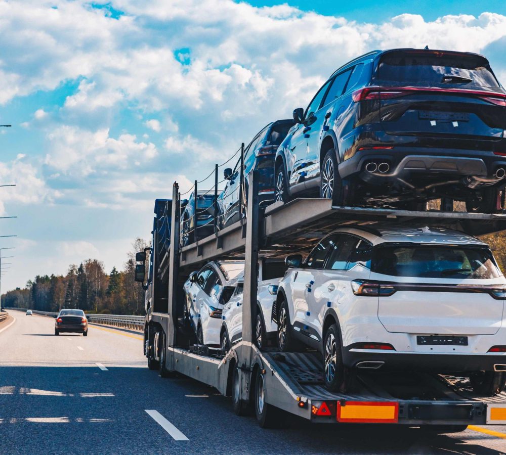 car-transport-truck-driving-on-highway-road-car-c-2026-03-24-14-12-51-utc (1) (1) (1)