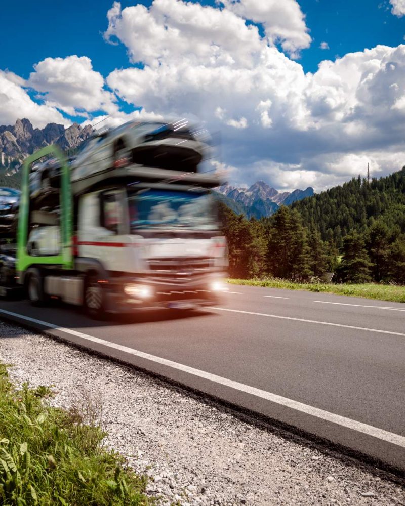 truck-trailer-transports-new-cars-rides-on-highway-2026-03-24-04-54-03-utc (1)