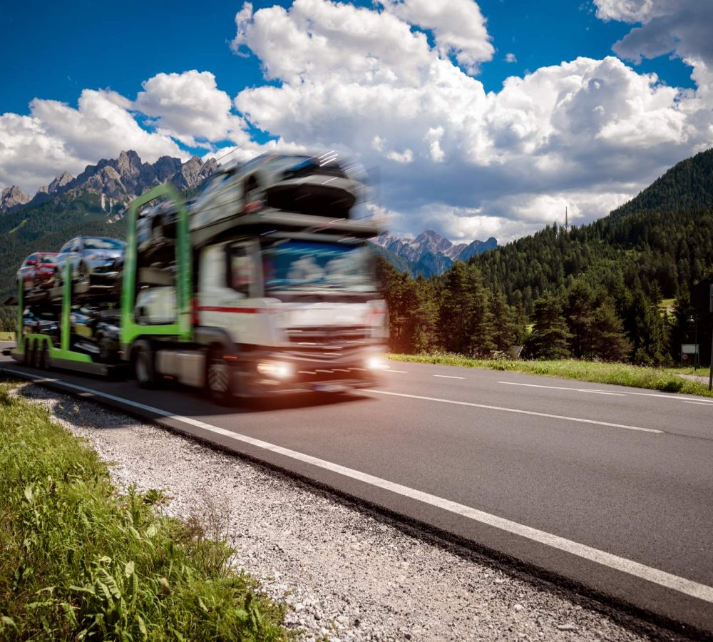 truck-trailer-transports-new-cars-rides-on-highway-2026-03-24-04-54-03-utc (1)