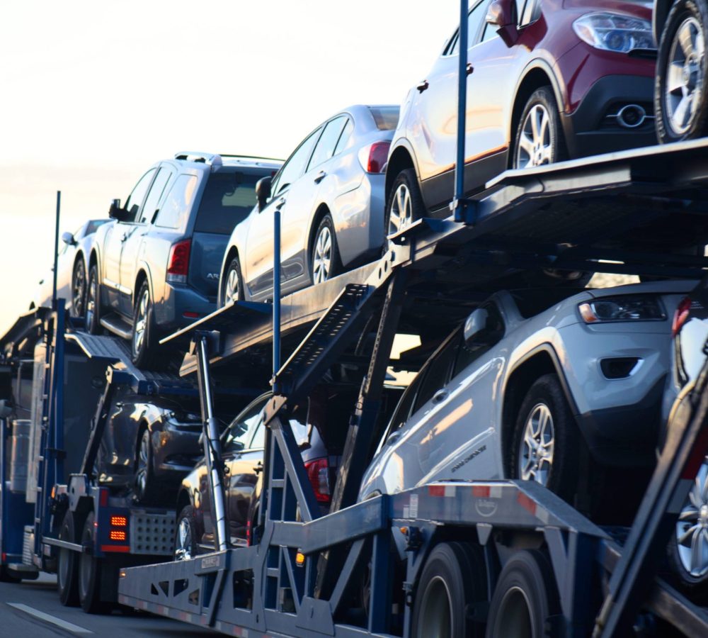 truck-transporting-new-automobiles-on-a-highway-2026-03-19-23-14-40-utc (1)